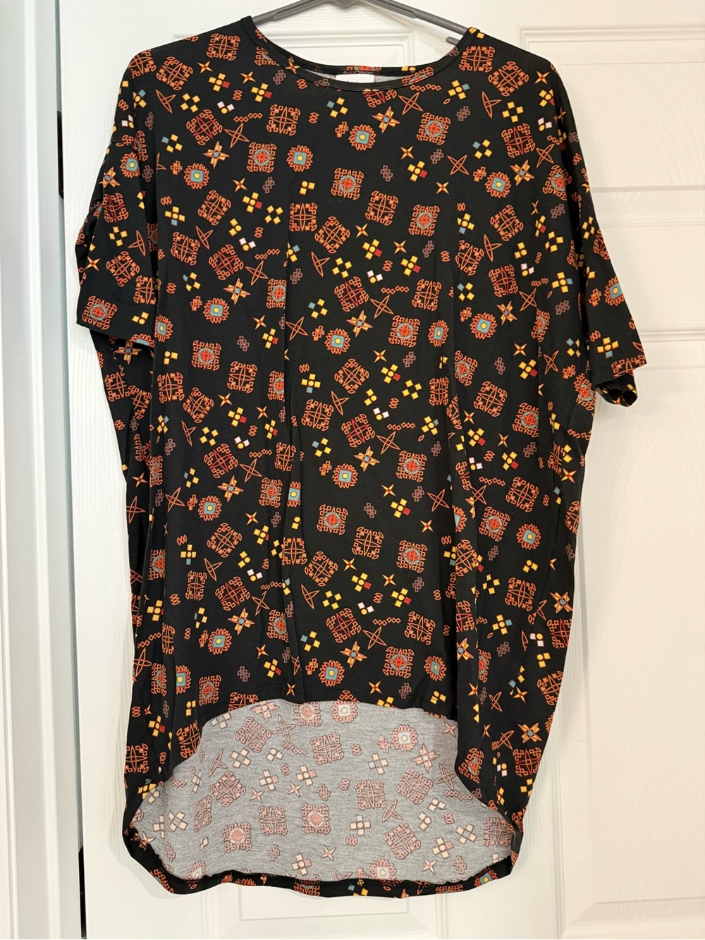 LuLaRoe Irma Black Short Sleeve Top with Orange and Yellow Geometric Print